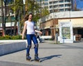 Happy Roller Girl skating in the park