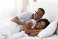Romantic black couple bonding in bed at home Royalty Free Stock Photo