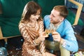 Happy romantic couple clinking glasses with sparkling wine, enjoying evenrning party, having date at Valentine`s Day. Royalty Free Stock Photo