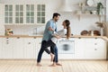 Happy romantic couple dancing in modern kitchen at home Royalty Free Stock Photo