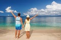 Happy romantic couple enjoying views beautiful islands on beach.