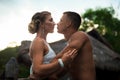 Happy romantic couple in love hug and kiss on beach at summer day Royalty Free Stock Photo