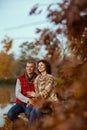 happy romantic couple in park while sitting on bench Royalty Free Stock Photo