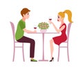 Happy romantic couple in restaurant. Man and woman sit at table drink wine talking, celebrate valentine holiday together Royalty Free Stock Photo