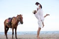 Happy Romantic Couples lover holding hands together walking on the beach Royalty Free Stock Photo