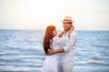 Happy Romantic Couples lover holding hands together walking on the beach Royalty Free Stock Photo