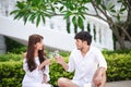 Happy Romantic Couples lover talking and drinking wine while having a picnic at home Royalty Free Stock Photo