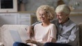 Happy romantic mature couple relaxing on home couch together Royalty Free Stock Photo