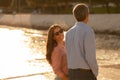 Happy Romantic Mature Couple Walking Together Along The Beach In Sunset Royalty Free Stock Photo