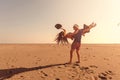 Happy Romantic Middle Aged Couple Enjoying Beautiful Sunset Walk on the Beach Royalty Free Stock Photo