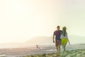 Happy Romantic Middle Aged Couple Enjoying Beautiful Sunset Walk on the Beach Royalty Free Stock Photo