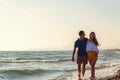 Happy Romantic Middle Aged Couple Enjoying Beautiful Sunset Walk on the Beach