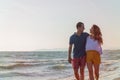 Happy Romantic Middle Aged Couple Enjoying Beautiful Sunset Walk on the Beach Royalty Free Stock Photo