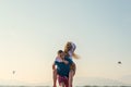 Happy Romantic Middle Aged Couple Enjoying Beautiful Sunset Walk on the Beach