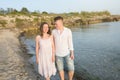 Happy Romantic Middle Aged Couple Enjoying Beautiful Sunset Walk on the Beach Royalty Free Stock Photo