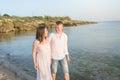 Happy Romantic Middle Aged Couple Enjoying Beautiful Sunset Walk on the Beach Royalty Free Stock Photo