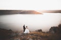 Happy and romantic scene of just married young wedding couple posing on beautiful beach Royalty Free Stock Photo