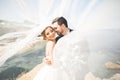 Happy and romantic scene of just married young wedding couple posing on beautiful beach Royalty Free Stock Photo