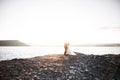 Happy and romantic scene of just married young wedding couple posing on beautiful beach