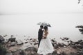 Happy and romantic scene of just married young wedding couple posing on beautiful beach Royalty Free Stock Photo