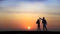 Happy Romantic young Couple dancing on the beach at sunset Royalty Free Stock Photo