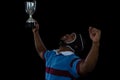 Happy rugby player holding trophy Royalty Free Stock Photo