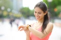 Happy runner checking time on smartwatch Royalty Free Stock Photo