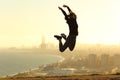 Happy runner jumping celebrating success at sunset Royalty Free Stock Photo