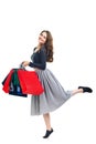 Happy running beautiful woman with many colorful shopping bags i Royalty Free Stock Photo