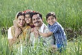 Rural family of farmer on agriculture field