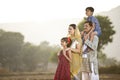 Happy rural Indian family on agricultural field Royalty Free Stock Photo