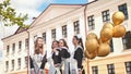 Happy Russian female graduates pose on their graduation day. Royalty Free Stock Photo