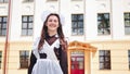 Happy Russian schoolgirl graduates pose on their graduation day. Royalty Free Stock Photo