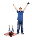 Happy, sad and children with video games on a white background for playing, celebration and winning. Family, siblings Royalty Free Stock Photo