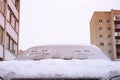 Happy and sad smiley emoticon face in snow on car windows, winter season joy and happiness concept Royalty Free Stock Photo