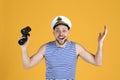 Happy sailor with binoculars on yellow background Royalty Free Stock Photo