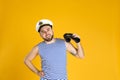 Happy sailor with binoculars on yellow background Royalty Free Stock Photo