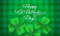 Happy Saint Patrick`s day card with shamrock clover on green gingham background. Vector St Patrick lettering Royalty Free Stock Photo