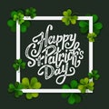 Happy Saint Patrick's day handwritten message, brush pen lettering on green shamrock background in square frame