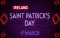 Happy Saint Patrick's Day of Ireland, 17 March. World National Days Neon Text Effect on bricks background Royalty Free Stock Photo