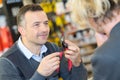 happy salesman assisting customer Royalty Free Stock Photo