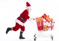 Happy Santa Claus with Christmas shopping cart Royalty Free Stock Photo