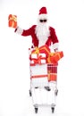 Happy Santa Claus with Christmas shopping cart Royalty Free Stock Photo