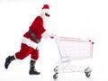 Happy Santa Claus with Christmas shopping cart Royalty Free Stock Photo