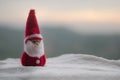 Happy Santa Claus Doll on Christmas time with tree and snow. Blurred outdoor background. Santa Clause and Merry Christmas model fi Royalty Free Stock Photo