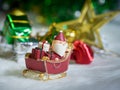 Happy Santa Claus with gifts box on the snow sled the background is Christmas decor.Santa Claus and Christmas decor on the snow. Royalty Free Stock Photo