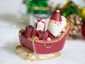 Happy Santa Claus with gifts box on the snow sled the background is Christmas decor.Santa Claus and Christmas decor on the snow. Royalty Free Stock Photo