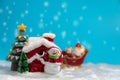 Happy Santa Claus with gifts box on the snow sled going to snow house. near snow house have Snowman and Christmas Tree. Santa Clau Royalty Free Stock Photo