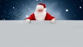 Happy Santa Claus holding Christmas blank advertisement banner background with copy space for your holiday text