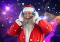 Happy santa claus listening music on headphones 3D Royalty Free Stock Photo